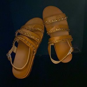 Brown strapped sandals with added gold details